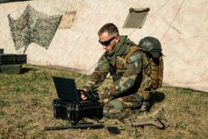 Soldier working with laptop