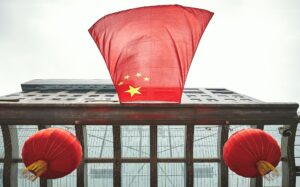 Looking up at Chinese flag.