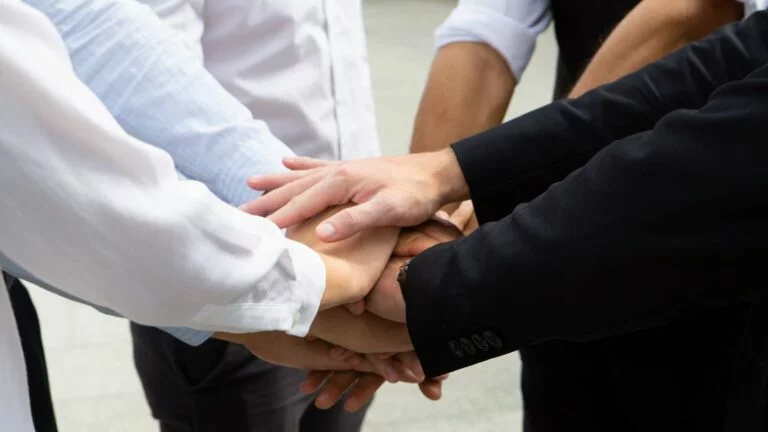 Hands on hand together as unity concept