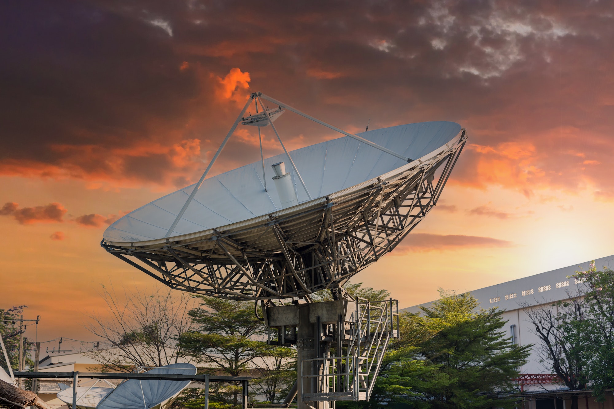 satellite dish radar antenna station in field. parabolic antennas
