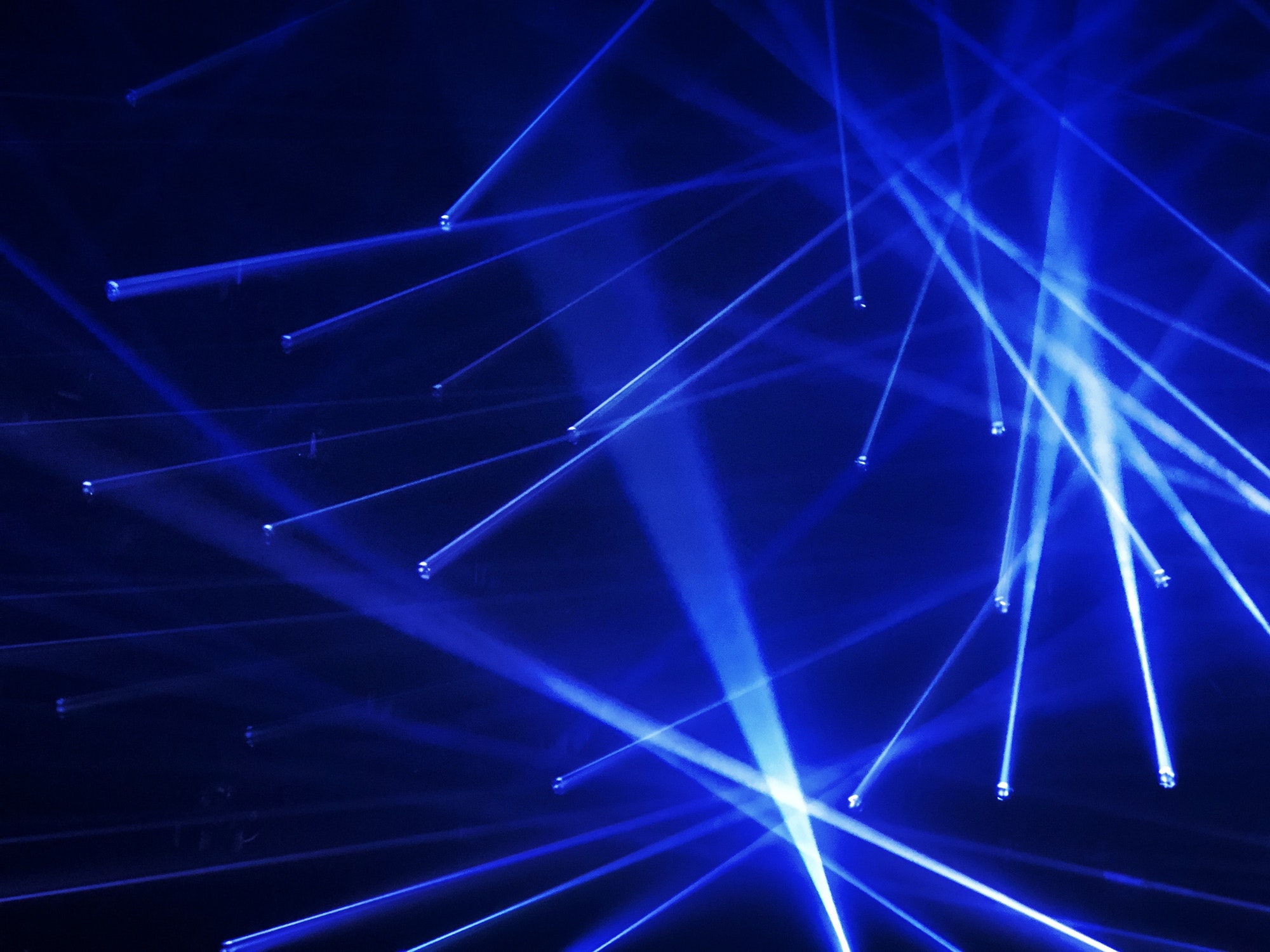 Blue laser lights on stage