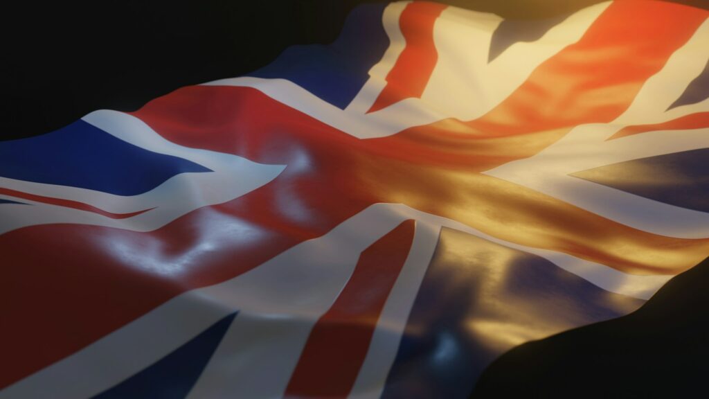 United Kingdom / UK Flag Close up with Warm Lighting on Black Background