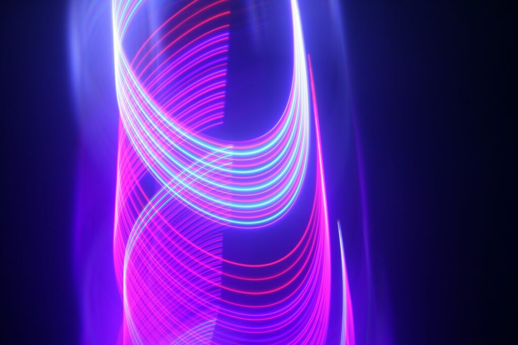 Abstract moving pink and blue neon lights for techno wallpaper or background
