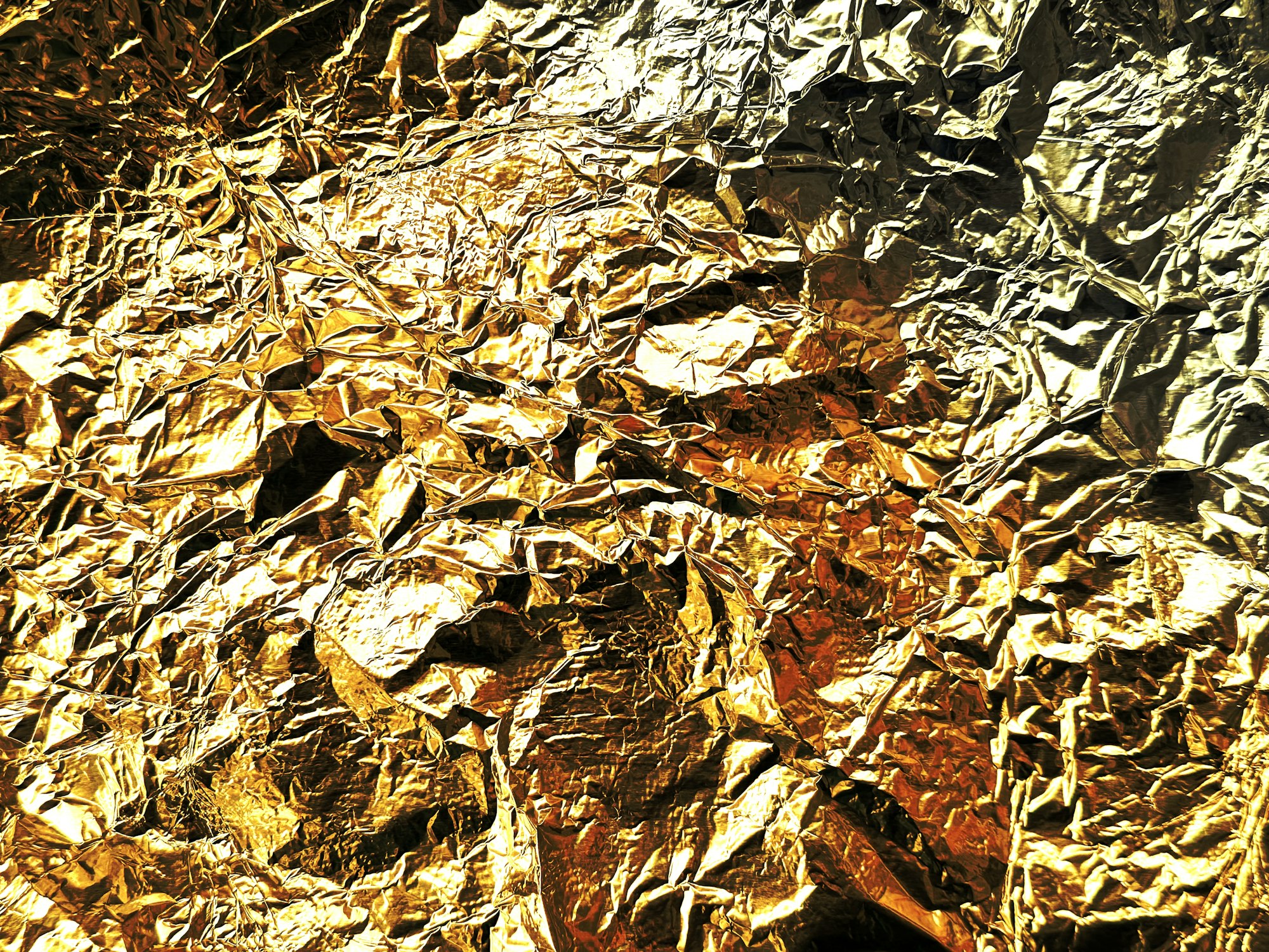 Close-up of the surface covered with gold-colored foil