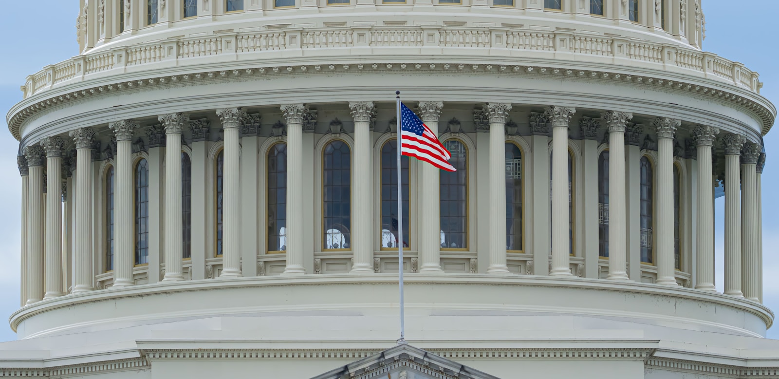 us a flag on white concrete building