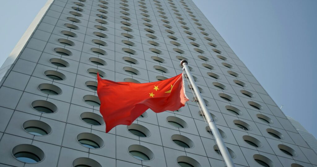 Central, Hong Kong 22 October 2019: Flag of China over business tower in Hong Kong