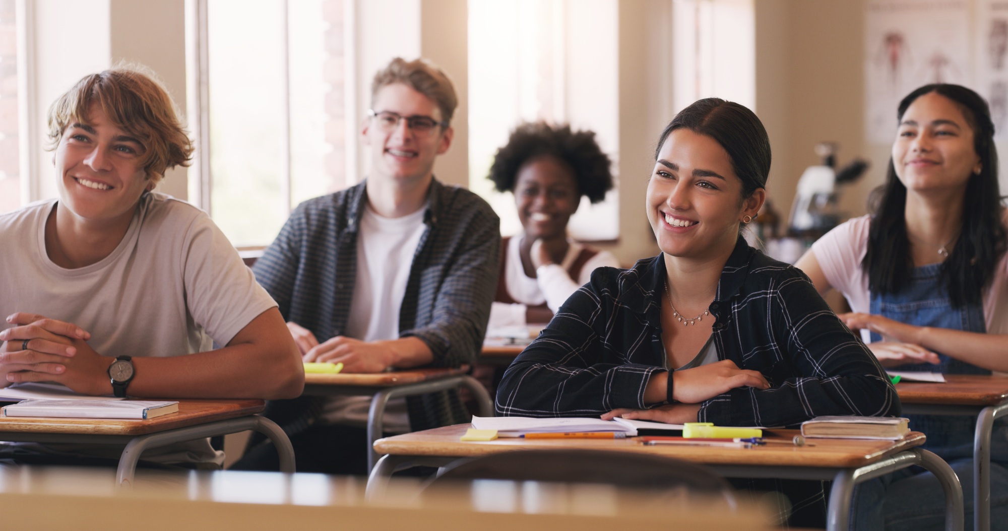 Shot of a group of teenagers in a classroom at high school