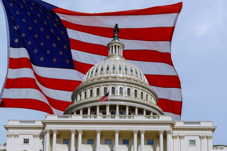 Washington DC Capitol Building on Capitol Hill detail on american flag background USA