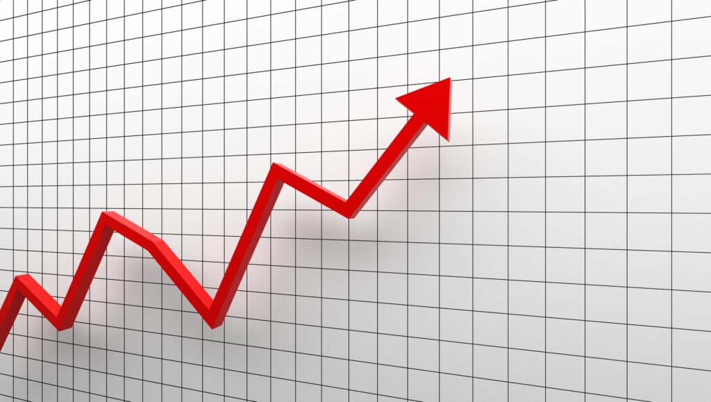 Growth diagram with red arrow going up on white background in success business concept