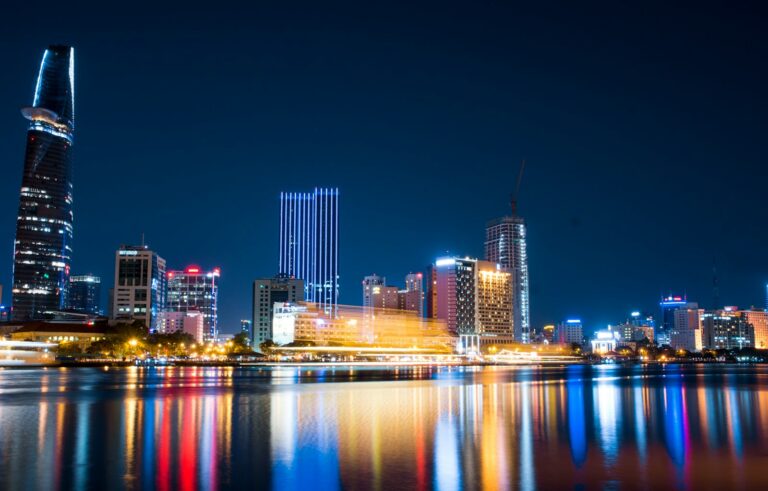 city buildings beside body of water