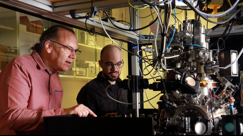 Professor Herwig Ott and Dr. Erik Bernhart in a vacuum chamber generating ultracold atomic clouds at 30 nK for a Bose–Einstein condensate Josephson junction experiment.