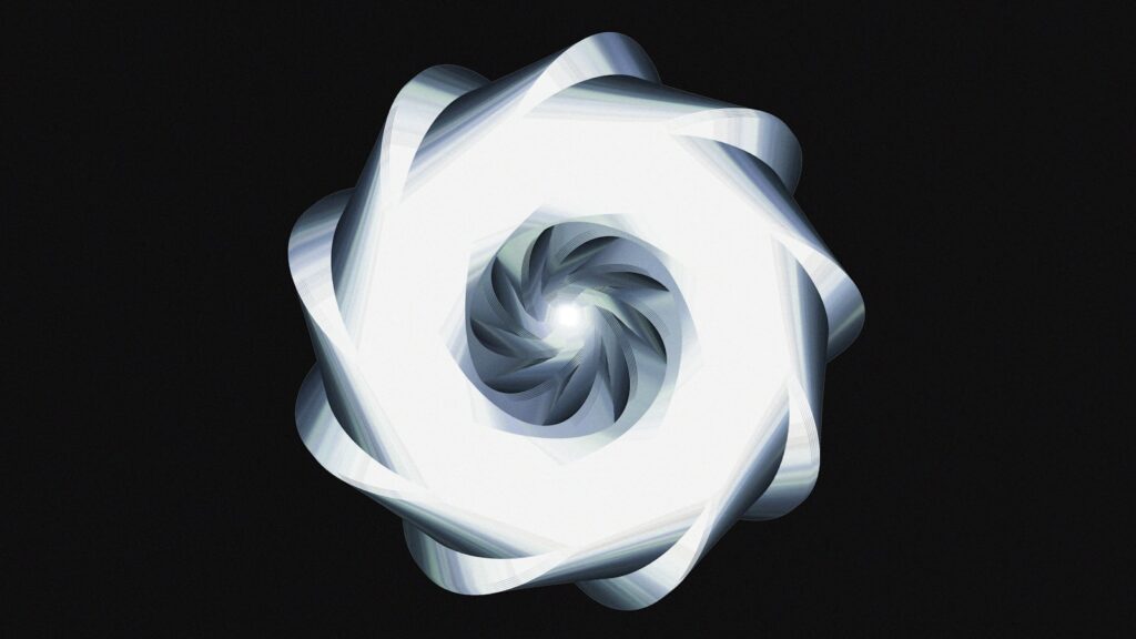 A luminous, spiraling design against black.