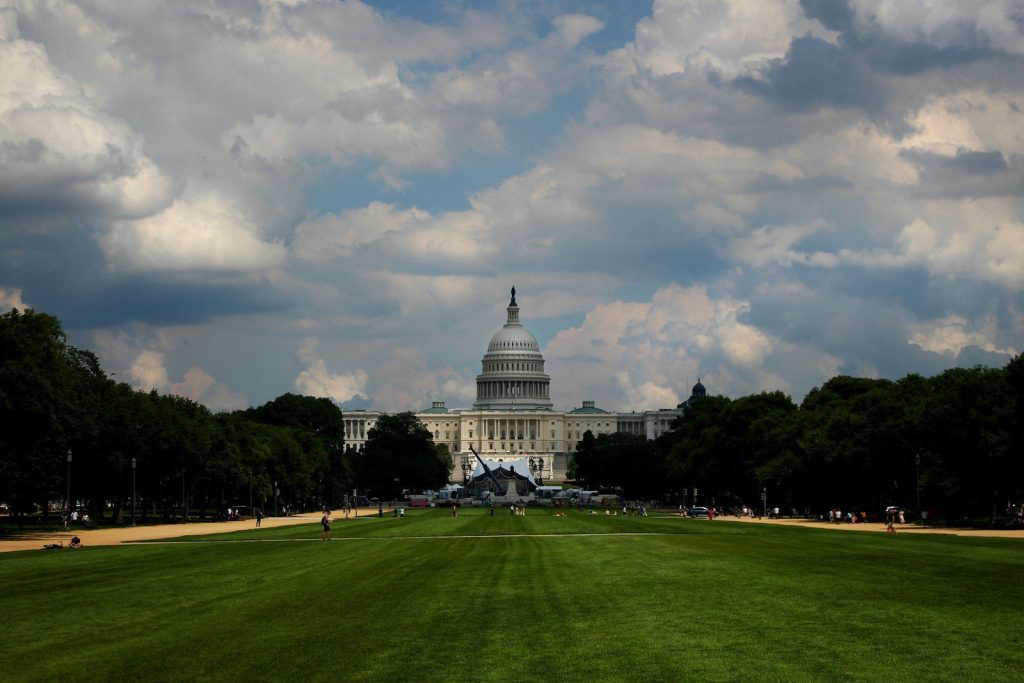 a view of the capitol building from across the lawn