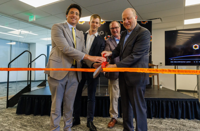 Cutting the ribbon at IonQ’s new Boulder facility were IonQ chairman and CEO Niccolo de Masi; Dr. Chris Ballance, president of Quantum Computing; Boulder mayor Aaron Brockett; and Colorado Gov Jared Polis. Courtesy IonQ Inc.