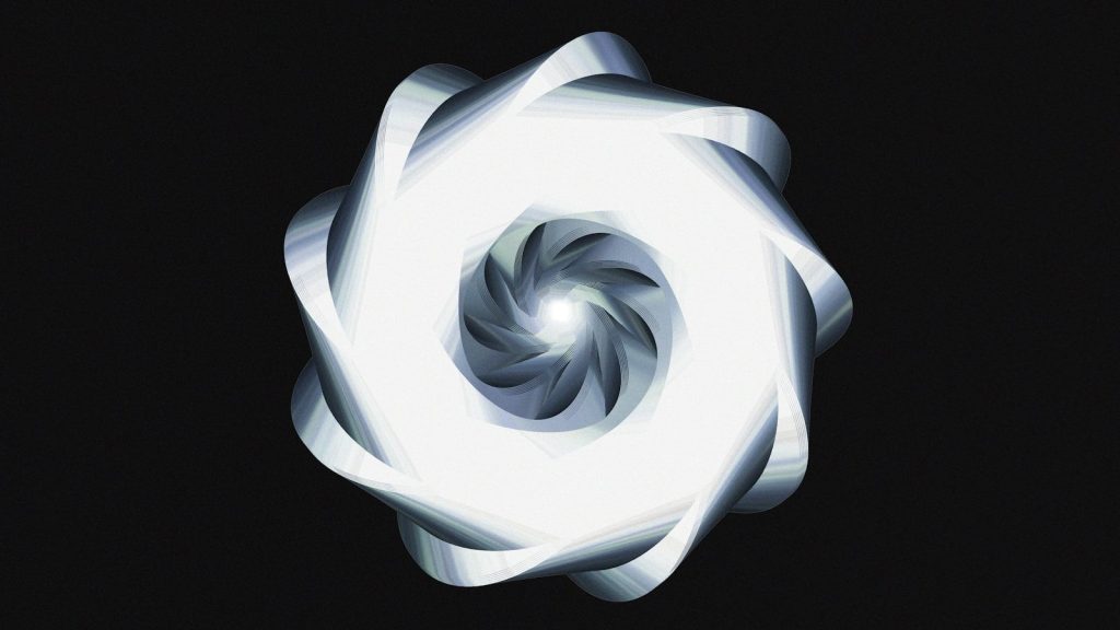 A luminous, spiraling design against black.