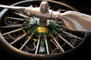 Detailed view of a vintage aircraft propeller engine in a Berlin museum.