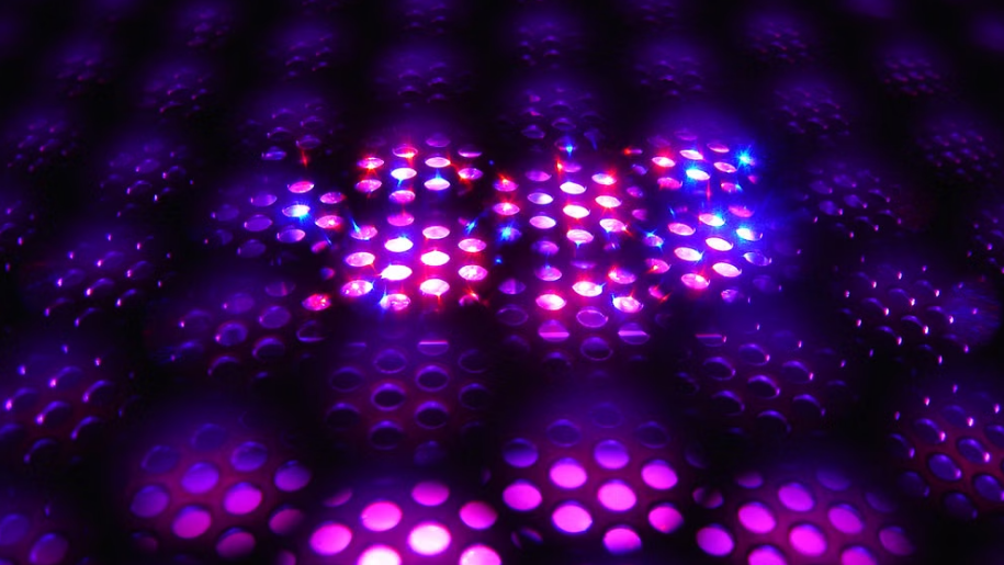 Close-up of an illuminated purple LED light grid with a futuristic appearance