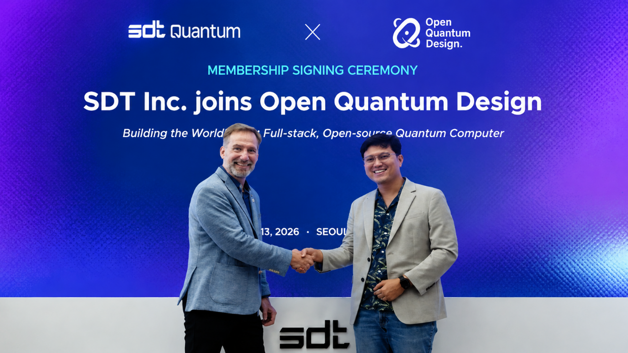 Greg Dick, co-founder and CEO of OQD (from left), and Yoon Ji-won, CEO of SDT, pose for a photo at the membership signing ceremony. Photo courtesy of SDT