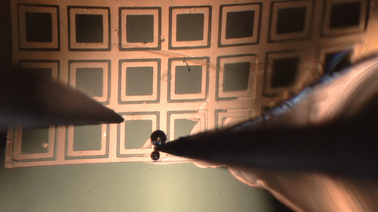 Diamond membranes are cut and removed from a larger layer of material using a special tool at Argonne.