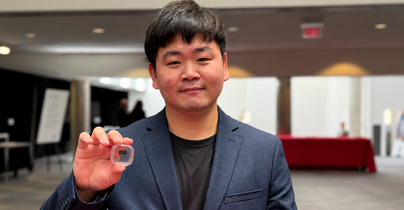 Hyeongrak “Chuck” Choi holds integrated quantum sensors that combine CMOS electronics with diamond color centers. Photo by Rita Langdon.