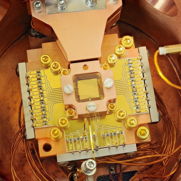 National Institute of Standards and Technology physicists used this apparatus to coax two electrically charged atoms into swapping the smallest measurable units of energy back and forth, a technique that may simplify information processing in a quantum computer. PHOTO: Y. COLOMBE / NIST