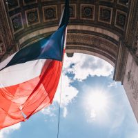 Paris flag and arc de triomphe